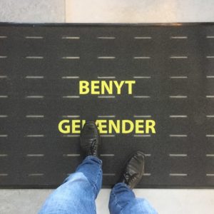 Anti-Slip industry mat with nudging text on concrete.