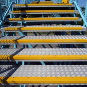 Anti-slip step nosing mounted on steel gratings.